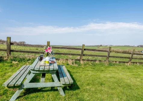 Enjoy far reaching countryside views from the enclosed rear garden at Highford Barn, Higher Clovelly
