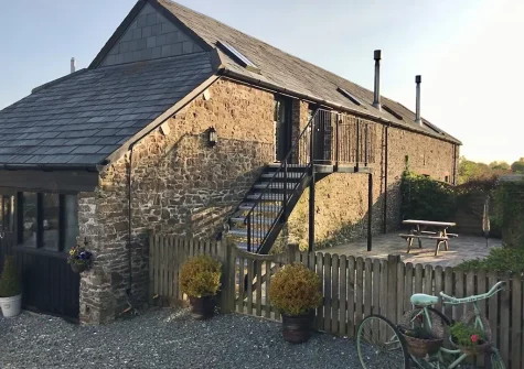 The rear patio & alfresco dining area at Hill Farm Fox Barn, Shebbear