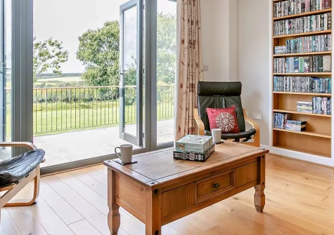 Hillcrest, Hartland is a spacious five-bedroom detached house perfect for families and groups. Enjoy expansive countryside views, beautiful gardens with entertainment facilities, and convenient access to North Devon's best beaches and attractions.