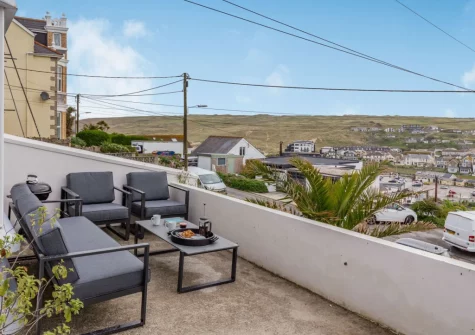 The terrace, barbecue & outdoor sitting area at Hillhead, Perranporth
