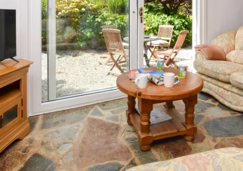 Hittisleigh Cottage, Hittisleigh is a characterful two-bedroom retreat nestled in peaceful Devon countryside, featuring exposed beams, contemporary interiors, an expansive private garden with covered dining area, and direct access to Dartmoor walks.