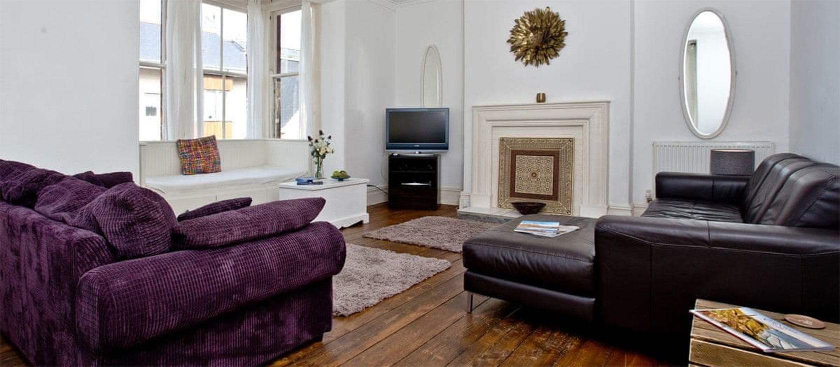 Hobart House, Newquay is a five bedroom three bathroom restored townhouse in the heart of Newquay overlooking Towan Beach. Ideal for ten guests with huge rooms, sea views and balcony. Private parking three cars - walk to everything in minutes!