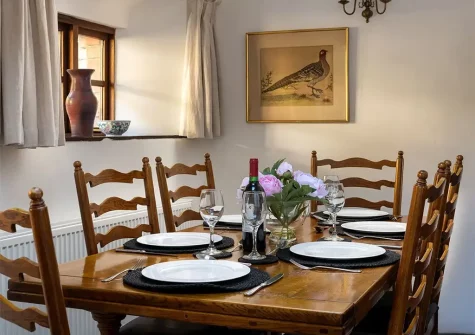 The dining room at Honey Buzzard Farmhouse, Coulscott, Combe Martin