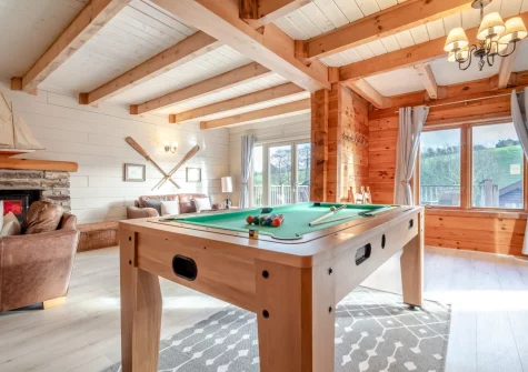 The living area with a multipurpose games table for pool, table tennis & air hockey