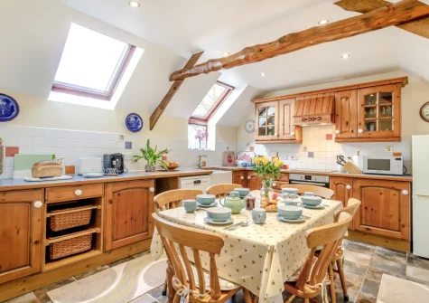 The kitchen & dining area at Honeysuckle Cottage, Frithelstock