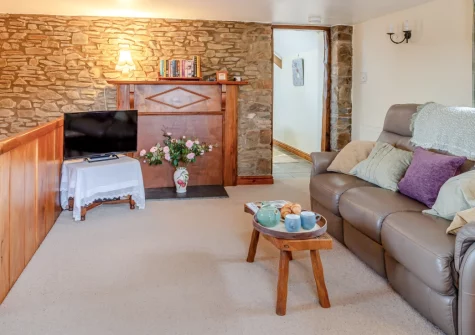 Honeysuckle Cottage, Frithelstock is a beautifully converted former granary on a peaceful 300-acre working farm, featuring a games barn with pool and table tennis, enclosed garden with barbecue, and the chance to explore the farm by Land Rover.