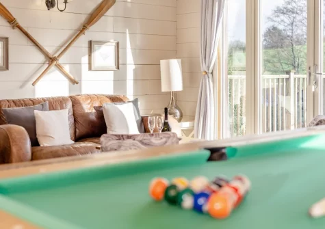 The living room, with multipurpose games table, at Honeywood, Little Petherick