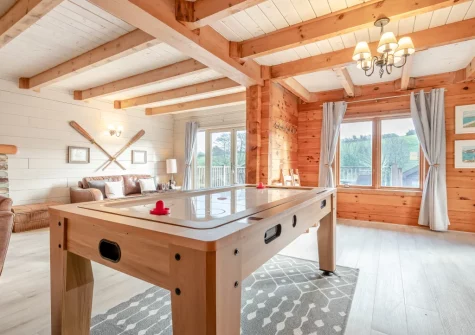 The living room, with multipurpose games table, at Honeywood, Little Petherick