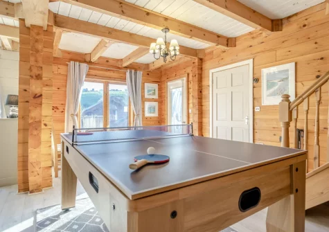The living room, with multipurpose games table, at Honeywood, Little Petherick