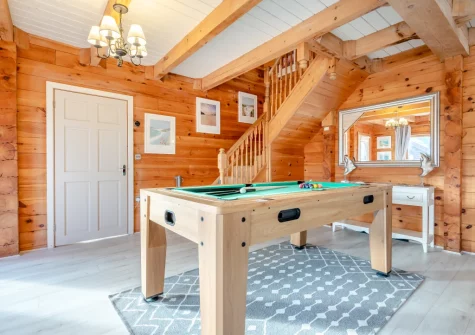 The living room, with multipurpose games table, at Honeywood, Little Petherick