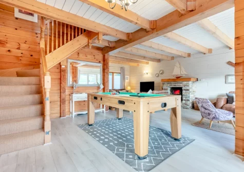 The living room, with multipurpose games table, at Honeywood, Little Petherick