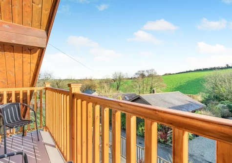 Bedroom #1 balcony & outdoor sitting area at Honeywood, Little Petherick