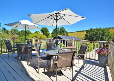 The decked terrace & alfresco dining area at Honeywood, Little Petherick