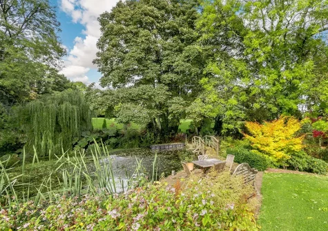 Roam throughout the 10 acres of beautifully manicured gardens when you stay at Hopetown Cottage, Trescott