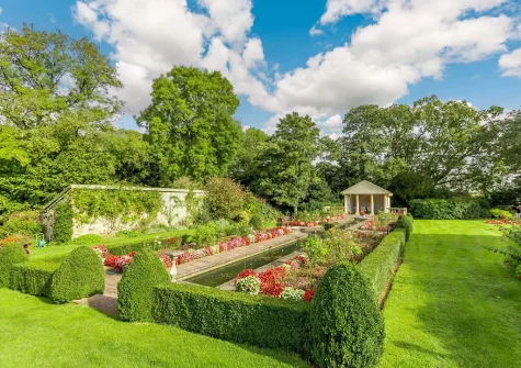 Roam throughout the 10 acres of beautifully manicured gardens when you stay at Hopetown Cottage, Trescott