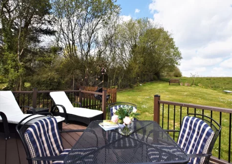 The decked patio, barbecue & alfresco dining area at Horseford Snug, East Worlington
