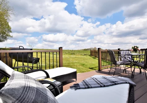 The decked patio, barbecue & alfresco dining area at Horseford Snug, East Worlington