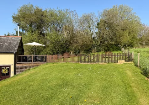 The enclosed lawned garden at Horseford Snug, East Worlington