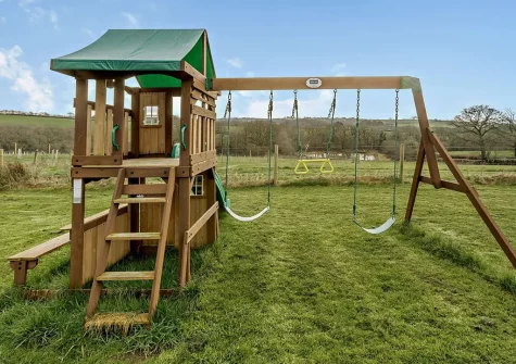 The shared children's play area at Horseshoe Cottage, Ashwater