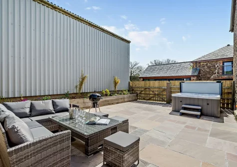 The patio, barbecue, outdoor sitting area & hot tub at Horslett Stable, Tetcott