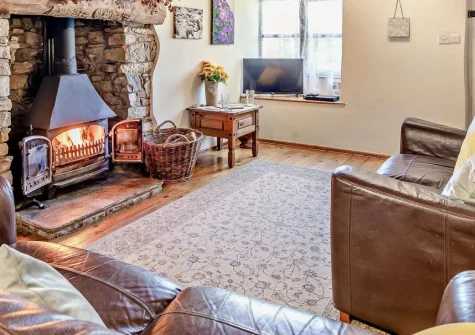 Hyacinth Cottage, Cubert is a delightful three-bedroom retreat in a quaint village setting, featuring a wood burner, private hot tub, and enclosed garden, with glorious beaches and coastal walks moments away and easy access to Newquay and Padstow.