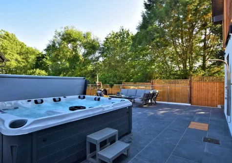 The hot tub, patio & outdoor sitting area at Hyford Wood, Bideford
