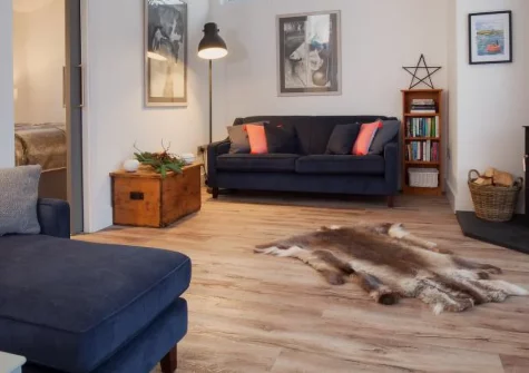 Hygge House, Shaldon is a stylish two-bedroom retreat in peaceful South Devon countryside, featuring a cosy wood burner, contemporary interiors, private patio with estuary views, and a shed stocked with beach gear for coastal adventures.