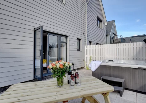 The patio, alfresco dining area & hot tub at Idle Hour, Westward Ho!