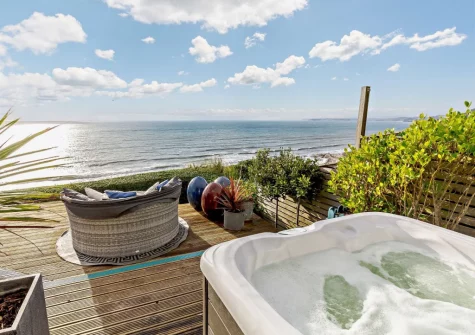 The decked terrace, hot tub & outdoor sitting area at Infinity, Freathy