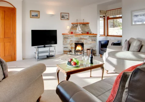 Inglenook, Porthleven is a charming three-bedroom retreat overlooking this picturesque fishing village, featuring gorgeous sea views, a cosy open fire, and a sunny garden terrace, with beautiful beaches and coastal walks just moments from your door.