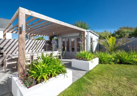 The patio & alfresco dining area & enclosed garden at Innisfree, Constantine Bay