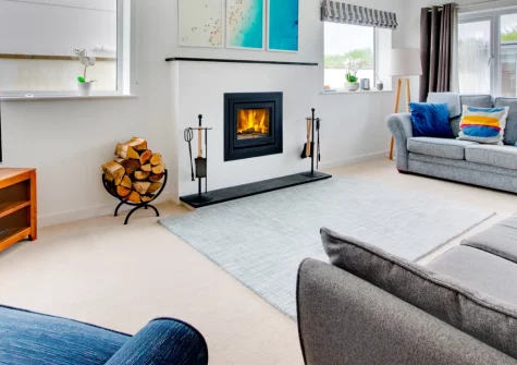 Innisfree, Constantine Bay is an exceptional six-bedroom retreat designed for memorable gatherings, featuring spacious entertaining areas with wood burner, enclosed lawned garden with alfresco dining space, and stylish interiors throughout.