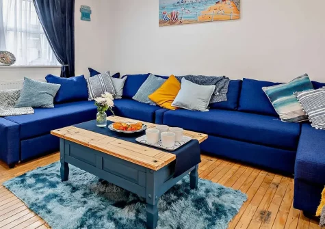 Into The Blue, Combe Martin is a stunning four-bedroom coastal sanctuary with fresh, light-filled interiors. Featuring a bubbling hot tub, games room packed with entertainment, and not far from sandy beaches, it's perfect for family seaside stays.