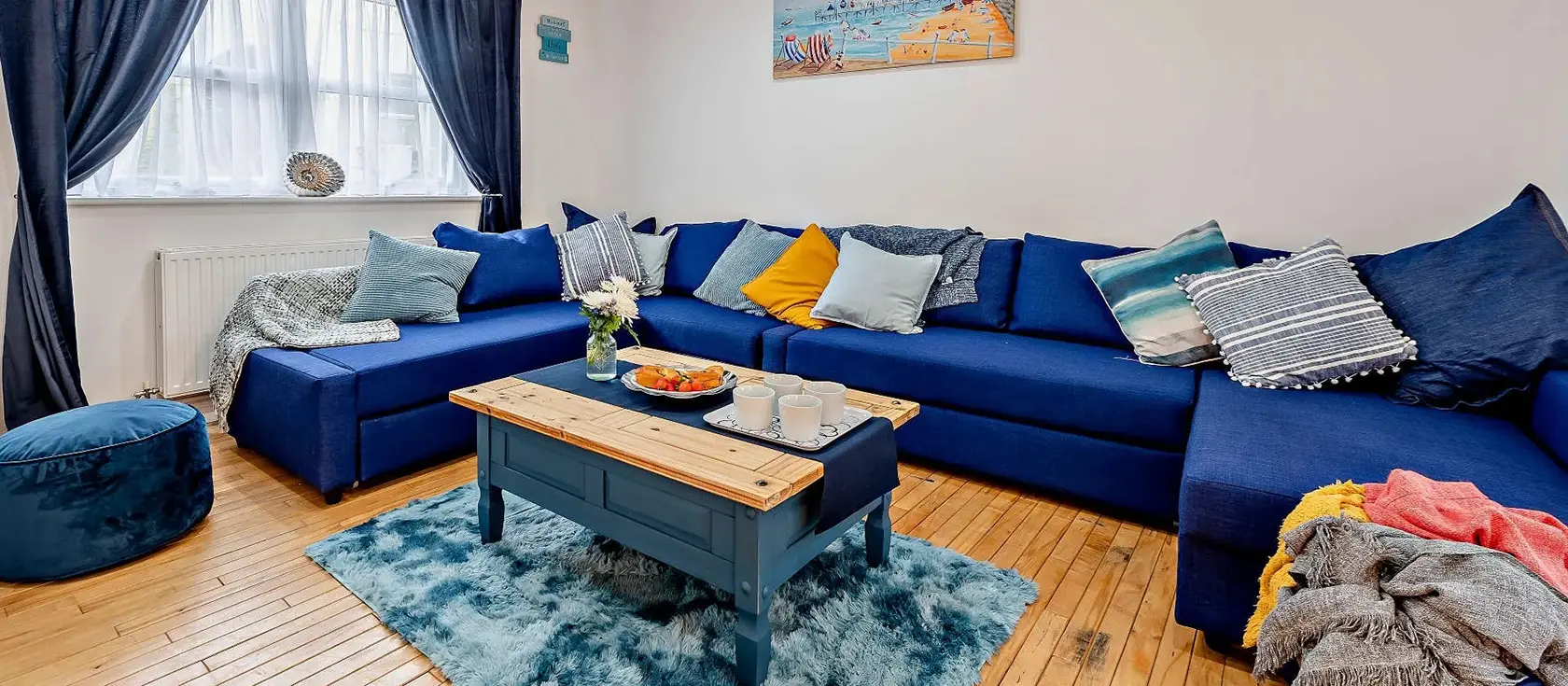 Into The Blue, Combe Martin is a stunning four-bedroom coastal sanctuary with fresh, light-filled interiors. Featuring a bubbling hot tub, games room packed with entertainment, and not far from sandy beaches, it's perfect for family seaside stays.