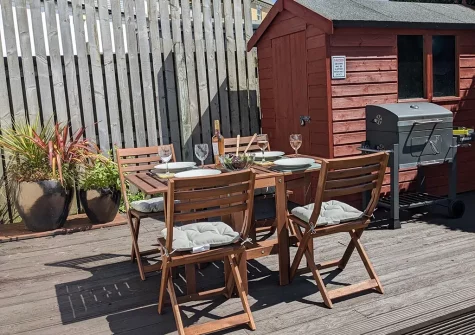 The decked patio & alfresco dining area at Islas Surfhouse, Newquay