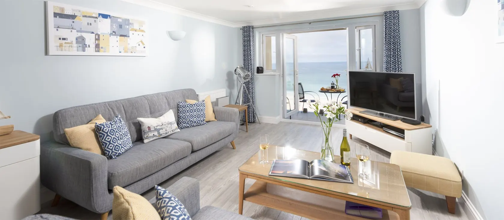 Ivory, Carbis Bay is a modern two bedroom apartment overlooking Carbis Bay beach. Stunning sea views from glass-enclosed balcony. Beautiful furnishings, two bathrooms, modern kitchen with dishwasher and designated parking. Close to St Ives & restaurants.