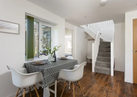 The dining area at Ivy Chimney Cottage, Wheal Rose