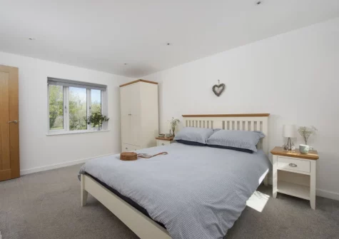 The bedroom at Ivy Chimney Cottage, Wheal Rose