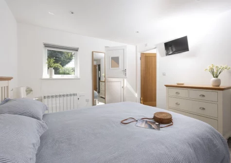 The bedroom at Ivy Chimney Cottage, Wheal Rose