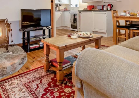 Ivy Cottage at Banns Farm, St Buryan, is a beautifully restored Grade II-listed stone cottage for two, featuring a cosy wood burner, an orchard fire pit perfect for stargazing, and easy access to Cornwall's finest beaches and most iconic landmarks.
