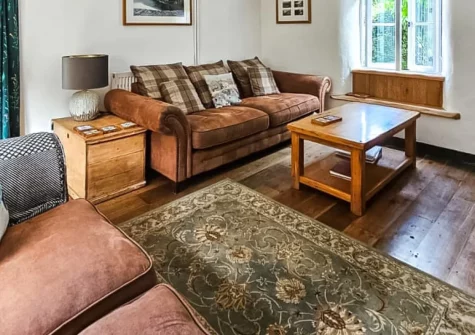 Ivy Cottage, Boscastle is a traditional stone-built retreat just moments from the historic harbour, featuring a sun room with valley views, enclosed garden with fire pit, and easy access to coastal walks and North Cornwall's finest attractions.