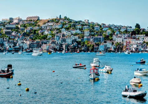 Fowey's vibrant maritime heritage is evident in its bustling harbour and working port with colourful boats sail in the gentle tide