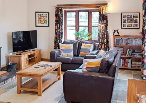 Jacks Barn, Welcombe is a beautifully renovated barn conversion set in peaceful North Devon countryside, featuring a cosy woodburner, enclosed lawned garden with patio, and flexible sleeping arrangements perfect for families or friends.