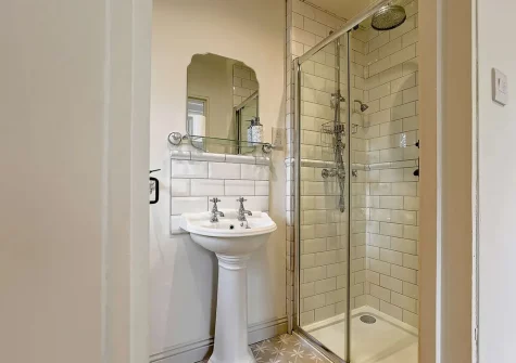 Bedroom #1 wn-suite shower room at Jasmine Barn, Lee