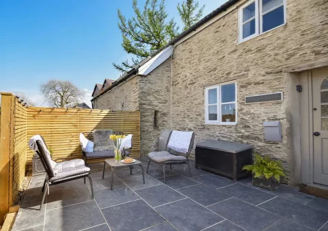 The patio & outdoor sitting area at Jasmine Barn, Lee