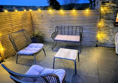 The patio & outdoor sitting area at Jasmine Barn, Lee
