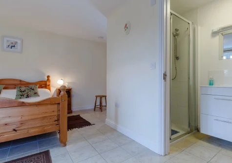 Bedroom #1 & en-suite shower room atJasmine Cottage at Little Roseveth, Tregavethan