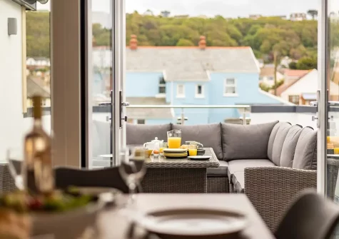 The front balcony & outdoor sitting area at Jeff's Bay, Westward Ho!