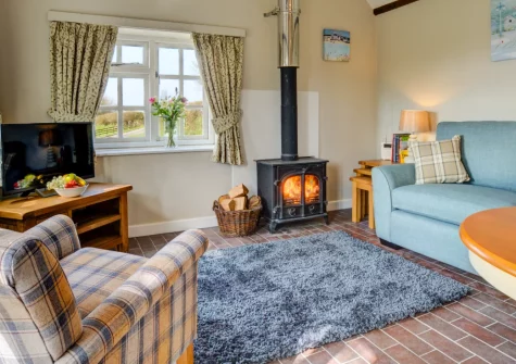 Jingles at Penrose Burden, St Breward is a cosy barn conversion for two, with lovely countryside views, a crackling wood burner, private patios and easy access to Bodmin Moor, the Camel Trail and Cornwall's dramatic coast for a peaceful getaway.