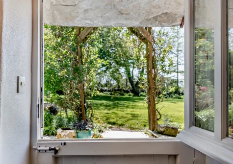 Step out onto the patip and large enclosed private garden